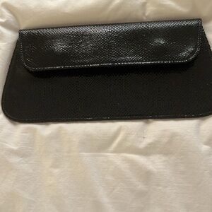 Vintage Elegant, textured, shiny black leather clutch.